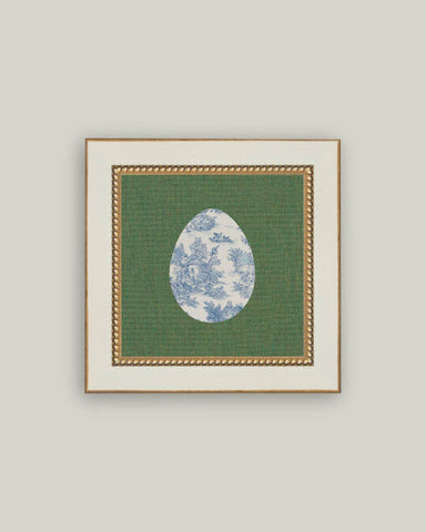 Framed artwork with a green background and blue floral design on a gray background