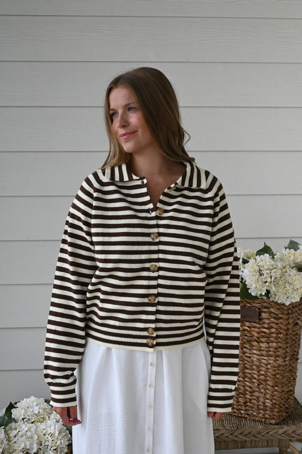 Brown and ivory striped knit cardigan with a collared neckline, button-front closure, long sleeves, and ribbed cuffs and hem.